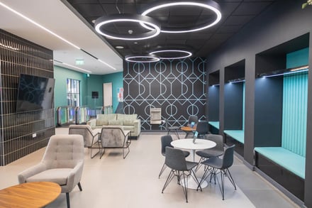 Sofas chairs table TV and booths common area at Onyx Birmingham in Birmingham Student Accommodation