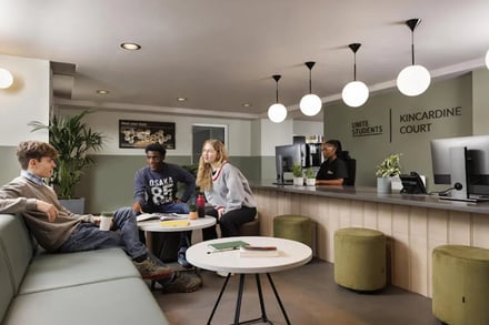 Students lounge seating reception desk area common room at Kincardine Court in Manchester Student Accommodation