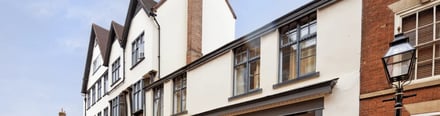 Tiled roofs and windows on cream building exterior at dwell Castle Gate Haus in Nottingham Student Accommodation