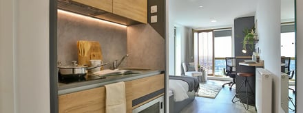 Kitchen counter with sink bed and desk area studio apartment at The Valentine London in London Student Accommodation