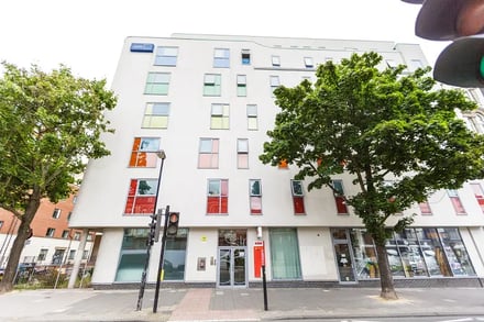 Modern student accommodation building with colorful windows exterior at AXO Islington in London Student Accommodation