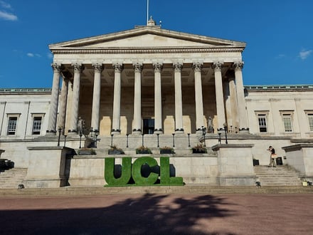 UCL letters on grass outside building exterior at University College London (UCL) Accommodation