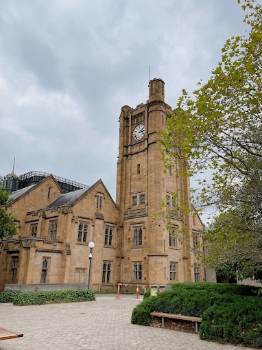 Historic building with clock tower exterior at University Of Melbourne Accommodation