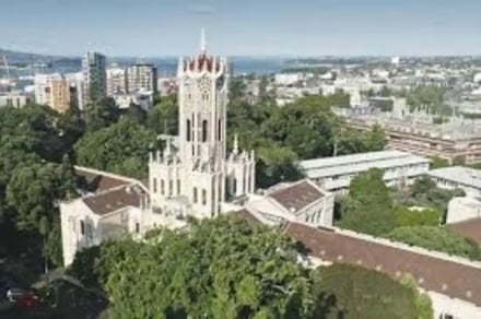 Gothic architecture tower surrounded by greenery exterior at The University Of Auckland Accommodation