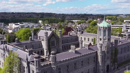 Historic stone university building with green dome exterior at National University Of Ireland Galway Accommodation