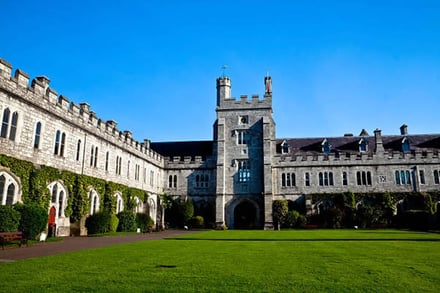 Stone building with tower and courtyard exterior at University College Cork Accommodation