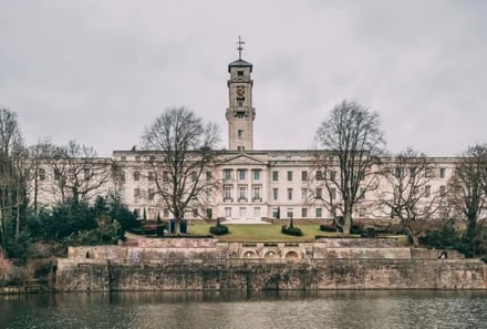 Large building with clock tower and water exterior at University Of Nottingham Accommodation