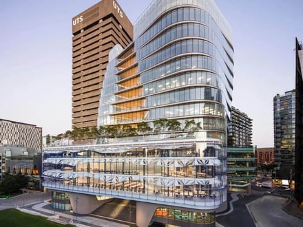 Modern glass building with tiered levels exterior at University Of Technology Sydney Accommodation