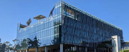 Modern glass building with solar panels exterior at Queensland University Of Technology Accommodation