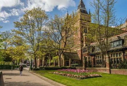 Brick building with tower garden and trees exterior at University Of Leeds Accommodation