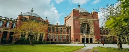 Historic red brick building with domes and large windows exterior at University Of Birmingham Accommodation