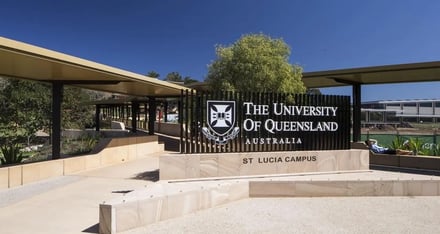 University sign and person resting exterior at University Of Queensland Accommodation