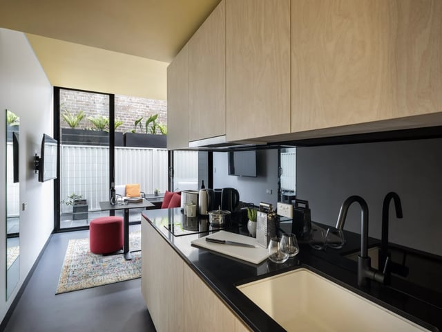 Modern kitchen with sink and cabinets kitchen at UKO Newtown in Sydney Student Accommodation
