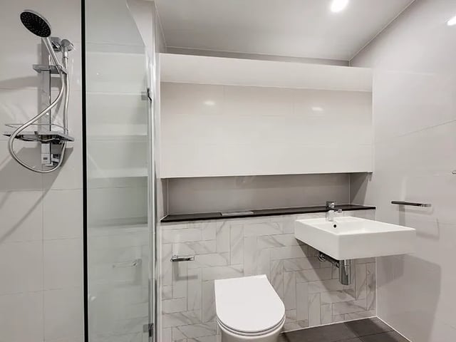 Shower toilet sink modern bathroom at Belong Mascot in Sydney Student Accommodation