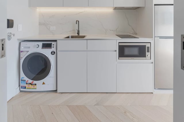 Washing machine microwave and fridge Kitchen at UKO Kensington in Sydney Student Accommodation