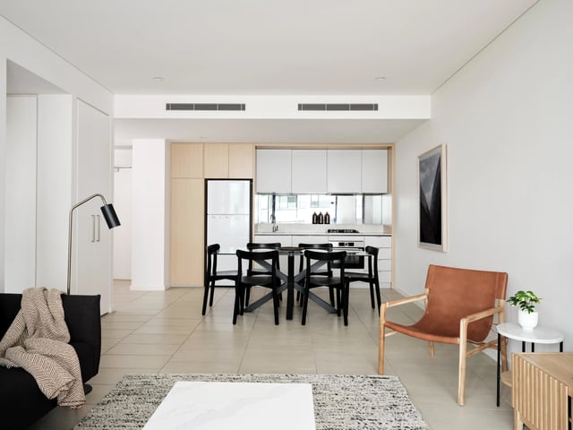 Modern living dining kitchen area with furniture. at UKO Camperdown in Sydney Student Accommodation