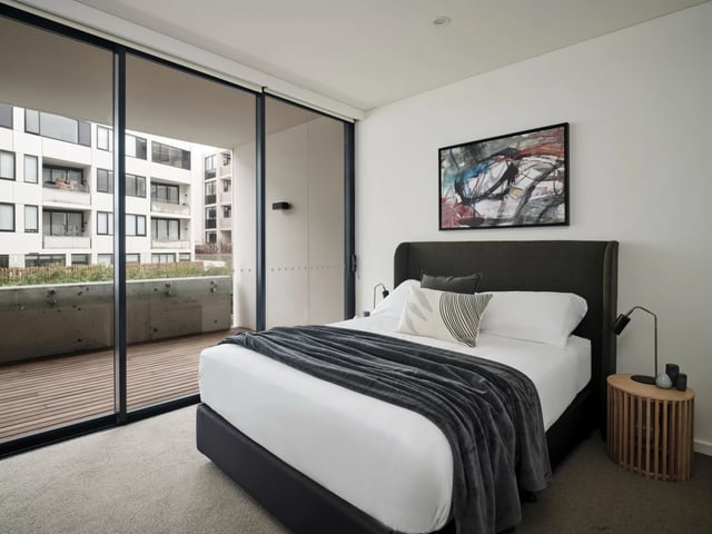 Bed balcony artwork abstract painting bedroom at UKO Camperdown in Sydney Student Accommodation