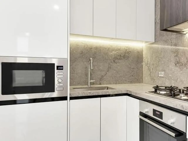 Microwave sink oven and stovetop kitchen at Belong Parramatta in Sydney Student Accommodation