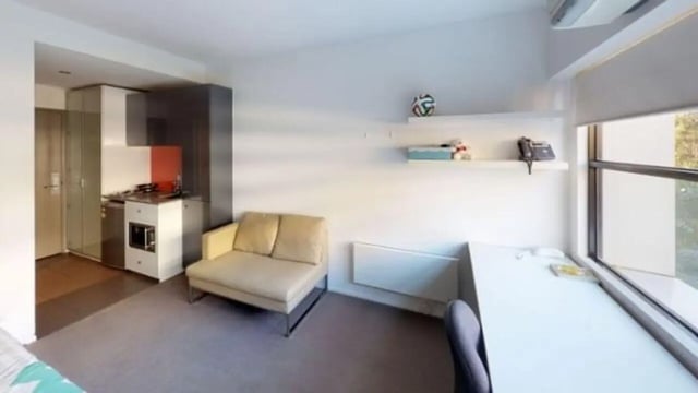 Sofa desk kitchen and window living room at Student Living D1 in Melbourne Student Accommodation