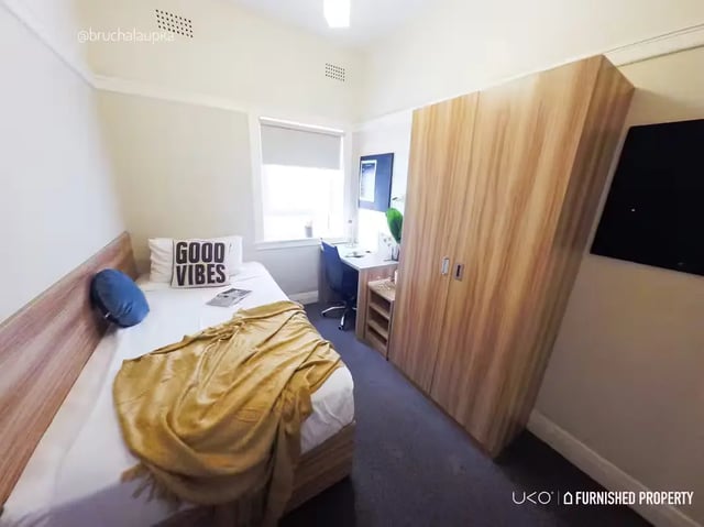 Bed study desk wardrobe and window bedroom at ume Potts Point in Sydney Student Accommodation
