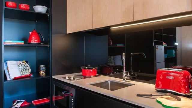 Red kettle pots toaster and shelves kitchen at UniLodge @ RMIT Bundoora-Walert House in Melbourne Student Accommodation
