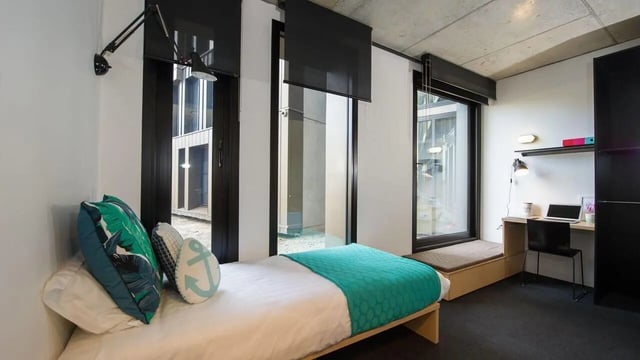 Bed desk chair and laptop bedroom at UniLodge @ RMIT Bundoora-Walert House in Melbourne Student Accommodation