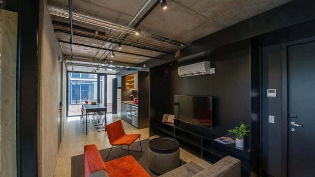 Orange chairs dining table kitchen and TV living room at UniLodge @ RMIT Bundoora-Walert House in Melbourne Student Accommodation