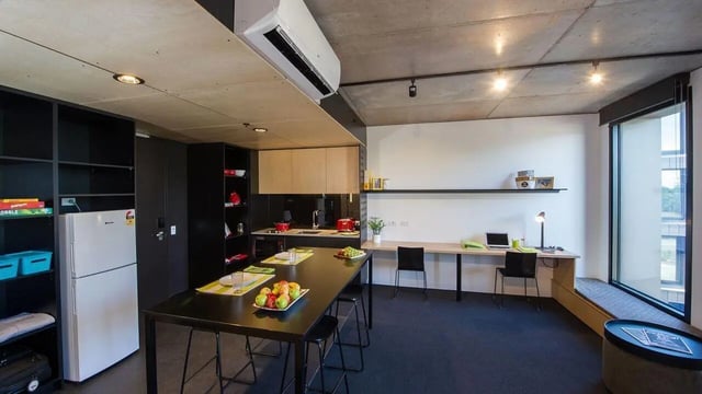 Fridge table study area with laptops kitchen area living room at UniLodge @ RMIT Bundoora-Walert House in Melbourne Student Accommodation