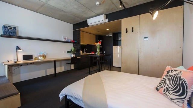Bed desk kitchen and fridge studio apartment at UniLodge @ RMIT Bundoora-Walert House in Melbourne Student Accommodation