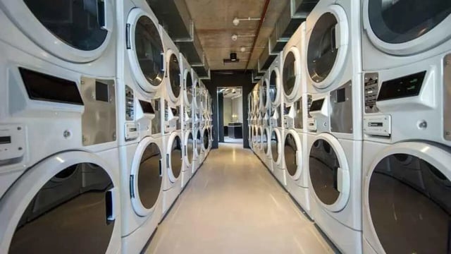 Stacking white washing machines laundry room at UniLodge @ RMIT Bundoora-Walert House in Melbourne Student Accommodation