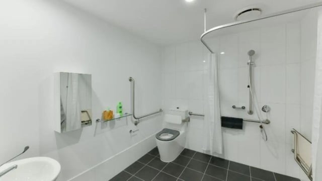 Accessible toilet shower grab bars sink mirror bathroom at UniLodge Toowong in Brisbane Student Accommodation