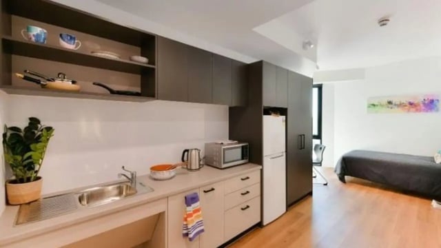 Kitchenette with sink microwave and bed bedroom at UniLodge Toowong in Brisbane Student Accommodation