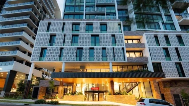 Modern building entrance with glass doors and signage exterior at UniLodge Toowong in Brisbane Student Accommodation
