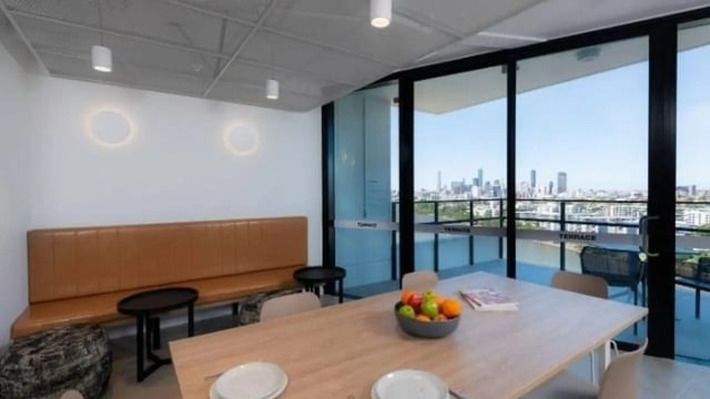 Dining table with fruit bowl and seating study area at UniLodge Toowong in Brisbane Student Accommodation