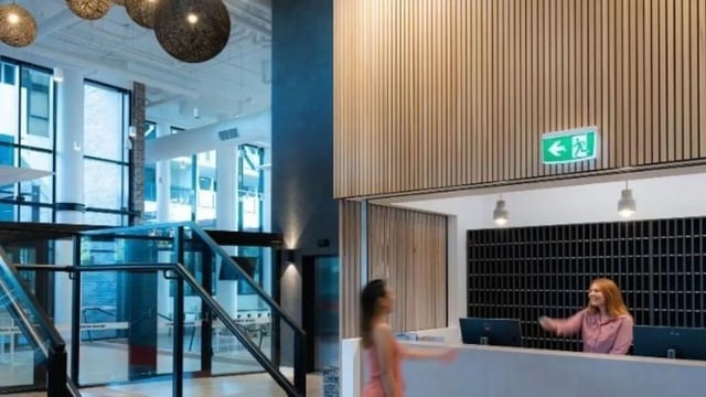 Reception desk with staff and lobby area interior at UniLodge Toowong in Brisbane Student Accommodation