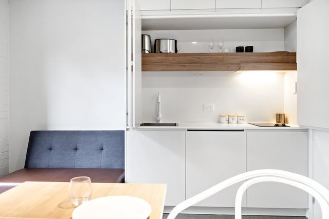 Bench seating with modern kitchen amenities kitchen at UKO Paddington in Sydney Student Accommodation
