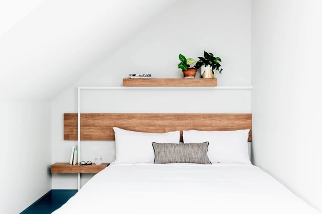 Bed with white pillows and plants Bedroom at UKO Paddington in Sydney Student Accommodation