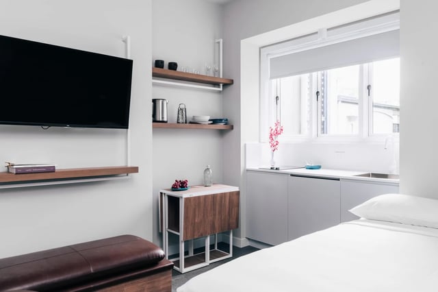 Television shelves folding table kitchen counter bed bedroom at UKO Paddington in Sydney Student Accommodation