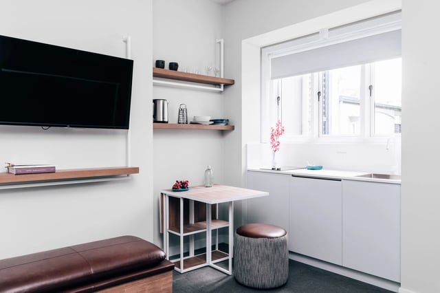 TV shelves table stool kitchen counter at UKO Paddington in Sydney Student Accommodation