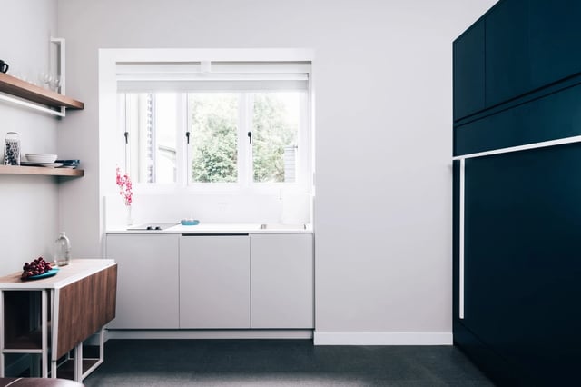 Foldable table dishes shelves modern kitchen with cabinets at UKO Paddington in Sydney Student Accommodation