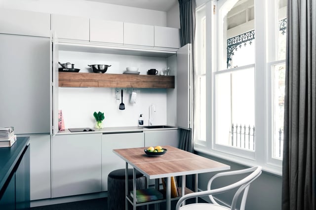 Compact kitchen with folding table and chairs kitchen at UKO Paddington in Sydney Student Accommodation