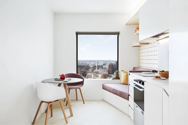 Dining table two chairs built-in bench kitchen kitchen at Scape Swanston in Melbourne Student Accommodation