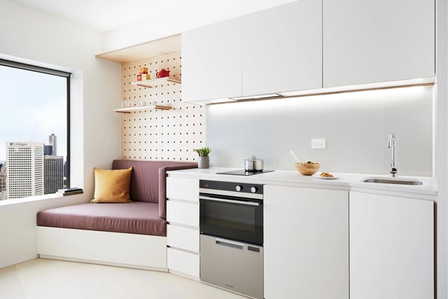 Modern kitchen with built-in bench window view kitchen at Scape Swanston in Melbourne Student Accommodation