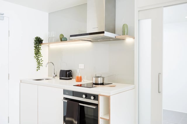 Modern kitchen with oven toaster and plants kitchen at Scape Swanston in Melbourne Student Accommodation