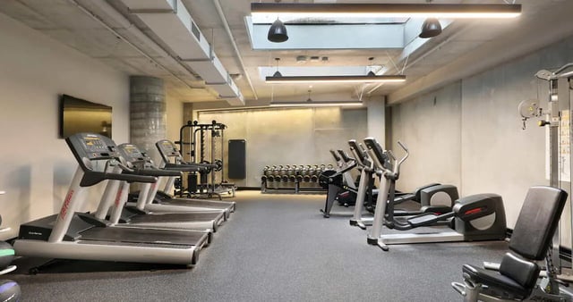 Treadmills ellipticals and weight machines gym at Iglu Melbourne City in Melbourne Student Accommodation