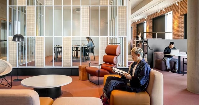 People studying and working in a lounge area at Iglu Redfern in Sydney Student Accommodation