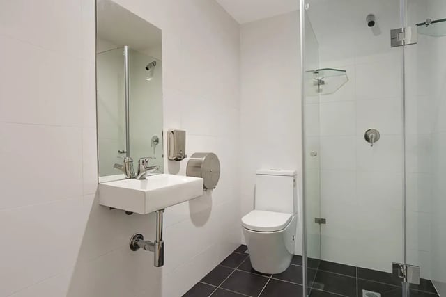 Toilet sink and glass shower enclosure bathroom at Link2 Central in Sydney Student Accommodation