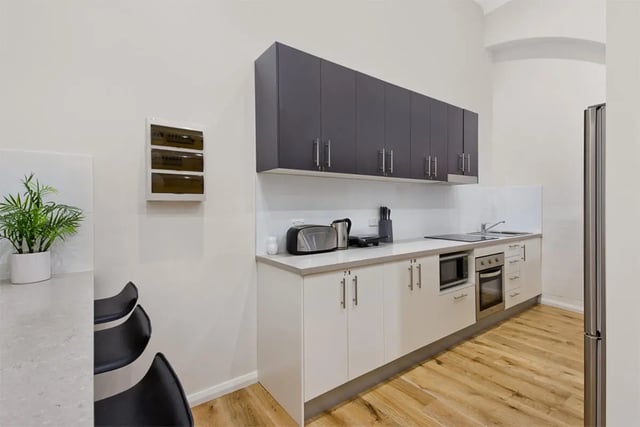 Modern kitchen with cabinets toaster kettle microwave oven kitchen at Link2 Central in Sydney Student Accommodation