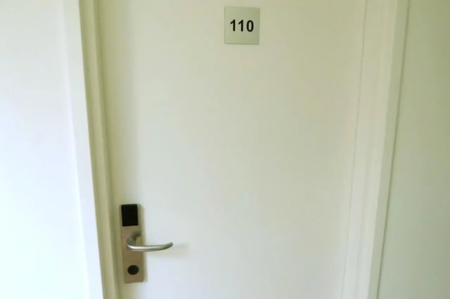 Door number 110 with silver handle Door image at Link2 Broadway in Sydney Student Accommodation
