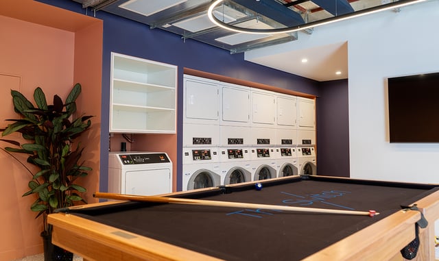 Pool table washing machines drying machines laundry room at The Switch Kensington in Sydney Student Accommodation